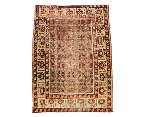 A DECCAN SILK RUGSOUTH INDIA, C.1800the mille fleurs field centred by a medallion enclosed by cream flowerhead borders and si