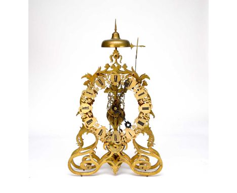 A brass skeleton clock, late 19th/20th century, of scroll pattern, the well-shaped plates formed of stylised foliate motifs, 
