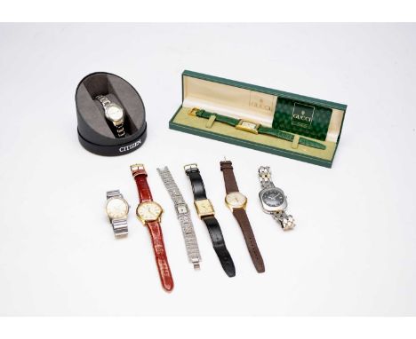 A collection of lady's and gentleman's wristwatches including: A Gucci ref. 2600M mid-size gold plated rectangular wristwatch