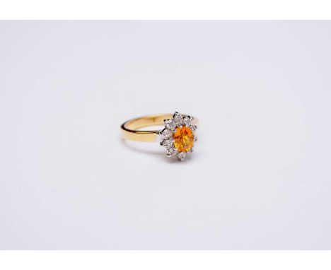  An 18ct gold yellow sapphire and diamond oval cluster ring, size K, weight approx 4.8g