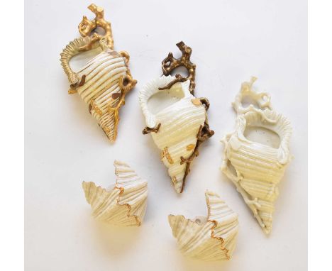 Three Royal Worcester wall pockets in the form of conch shells on branches, cream glazed, two with gilt, dated 1879 and 1880,