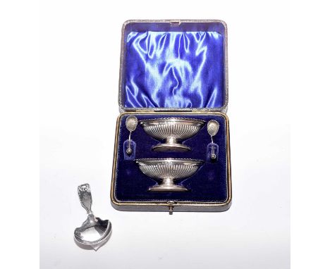 A Victorian cased pair of silver salts, William Henry Leather, Birmingham 1897, each of reeded urn form with matching spoons 