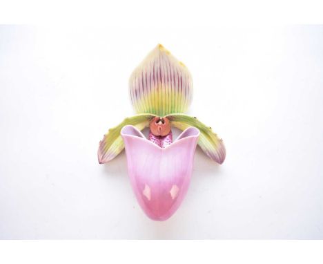A Royal Worcester wall pocket, circa 1885, modelled as a purple orchid with green and purple leaves, printed factory mark, 21