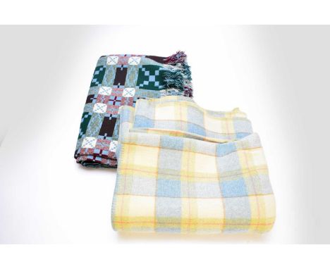 Two Welsh wool blankets, 20th century, the first by Derw, woven with a green, blue and burgundy plaid pattern, 155cm x 230cm;