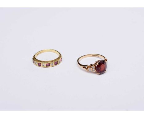 An 18ct gold nine stone ruby and daimond ring, size N 1/2, together with a 9ct gold garnet ring, size P, total weight approx 