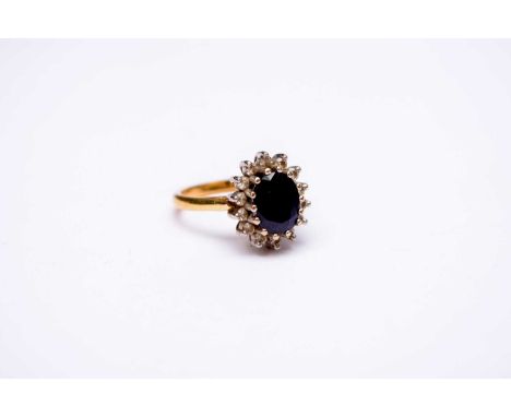 An 18ct gold sapphire &amp; diamond oval cluster ring, size O, weight approx 6.5g