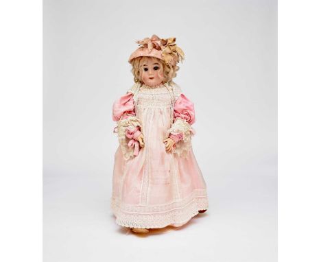 A Max Handwerck bisque-headed doll, marked 263/29E, circa 1910, the open mouth with four teeth, sleeping blue eyes, compositi