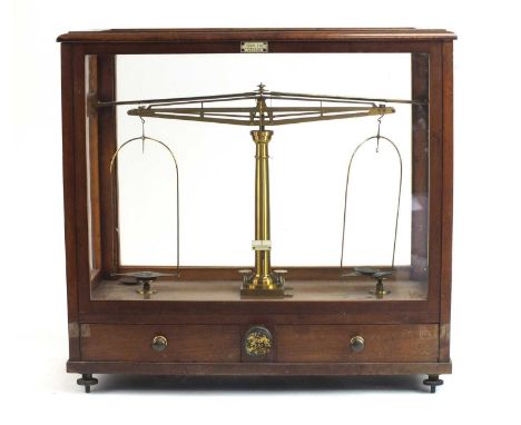 An assembled group of scientific instruments to include: A cased Edwardian scientific balance scale by James Howe, London; a 