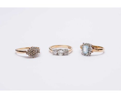 A 9ct gold graduated three stone diamond ring, size L 1/2, together with a 9ct gold diamond cluster ring, size N and a 9ct go