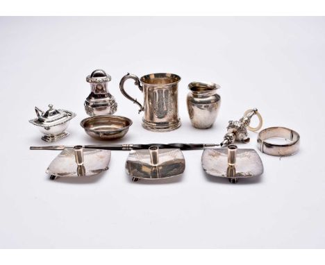 A Victorian silver chirstening mug, London 1843, 9.5cm high, together with a small silver vase, a silver rattle with mother o