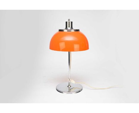 A mid-century Polish chrome and acrylic table lamp, the bright orange acrylic shade on a slender chromium stem and plain disc