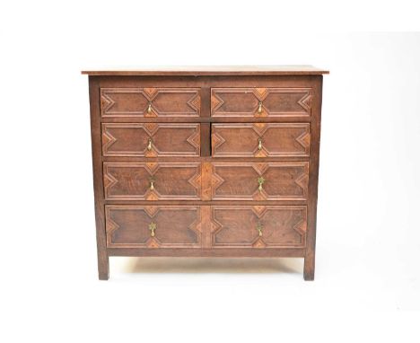 A 19th century, Jacobean style, oak chest of 4 short drawers above two long drawers, with a three-plank top and geometric bol