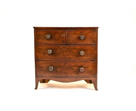 An early Victorian mahogany bow-front chest of drawers, the plain top above two short and two long cock-beaded drawers, havin