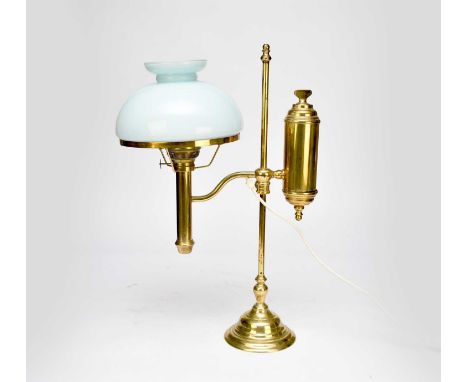A reproduction brass adjustable desk lamp, with opalescent pale blue glass dome shade, 61cm high.