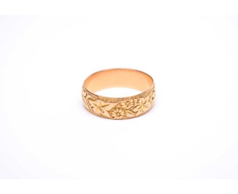 A George V 18ct gold wedding band, with floral decoration, hallmarked Chester 1915, ring size R 1/2, weight approx 5.1gHallma