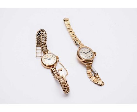 A Tissot lady's 9ct gold bracelet watch, the champagne dial with gold Arabic markers, polished round case with integral chain