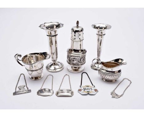 A small collection of silver, comprising; a sugar caster with embossed floral decoration, William Devenport, Birmingham 1917,