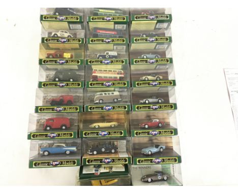 A collection of 23 boxed model cars by Corgi in the Classics series.