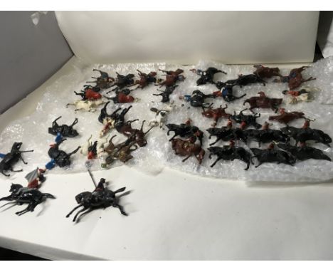 A collection in excess of 35 model metal mounted soldiers by Britains. Hillco and others. NO RESERVE