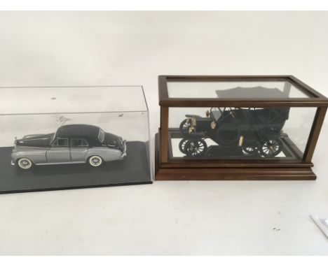 Three precision model cars by Franklin Mint both in presentation cases. Cars are 2 x RollsRoyce and a Ford.