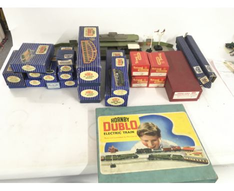 A collection of Hornby Dublo model railway trains and accessories 00 gauge mostly boxed. Includes some Triang and loose parts