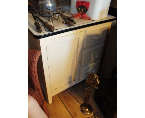 A cream painted enamel top low kitchen cabinet along with an enamel bread bin (2)