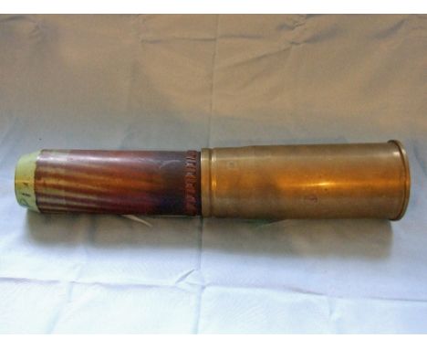 A British 76 mm round, base ejection for use in Saladin or Scorpion armoured vehicles, fired brass cartridge case with fired 