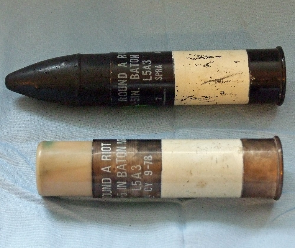 Two 1.5 in AntiRiot baton rounds, both in black anodized cartridge