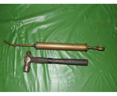 A WWII hammer circa 1940 along with a small grease gun