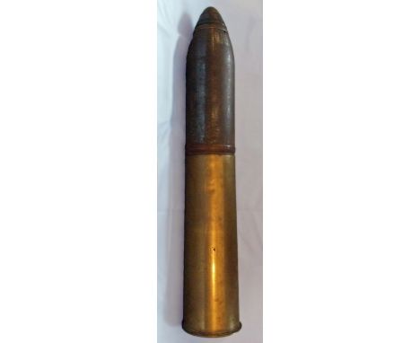 A British, World War I, HE round with brass No. 80 time and percussion nose fuze.  Brass cartridge case with no primer, and u