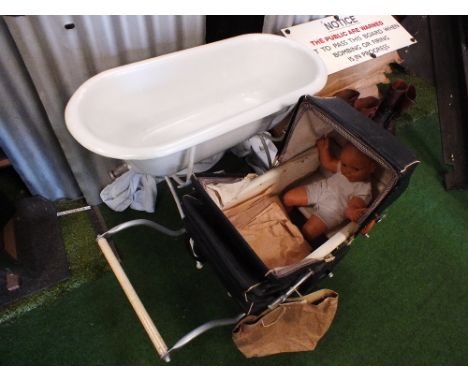 A Second World War era child's pram, together with an enamel bash tub (2)