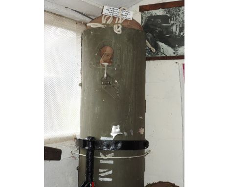 An aerial supply/weapons container fitted with a container parachute the body painted green and with white stencilling, 15C/1