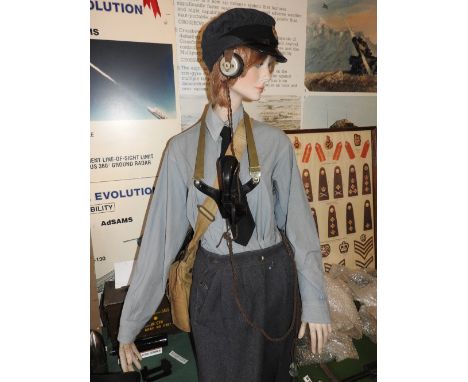 A WWII WRAF hat, shirt, tie, trousers and shoes along with a neck hang telephone receiver and headphones, canvas shoulder bag