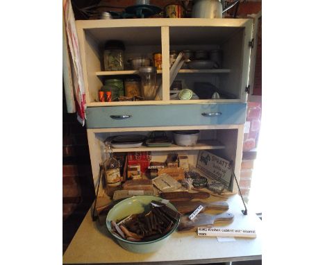 A collection of kitchen sundries including butter pats, enamel jars, tins, etc