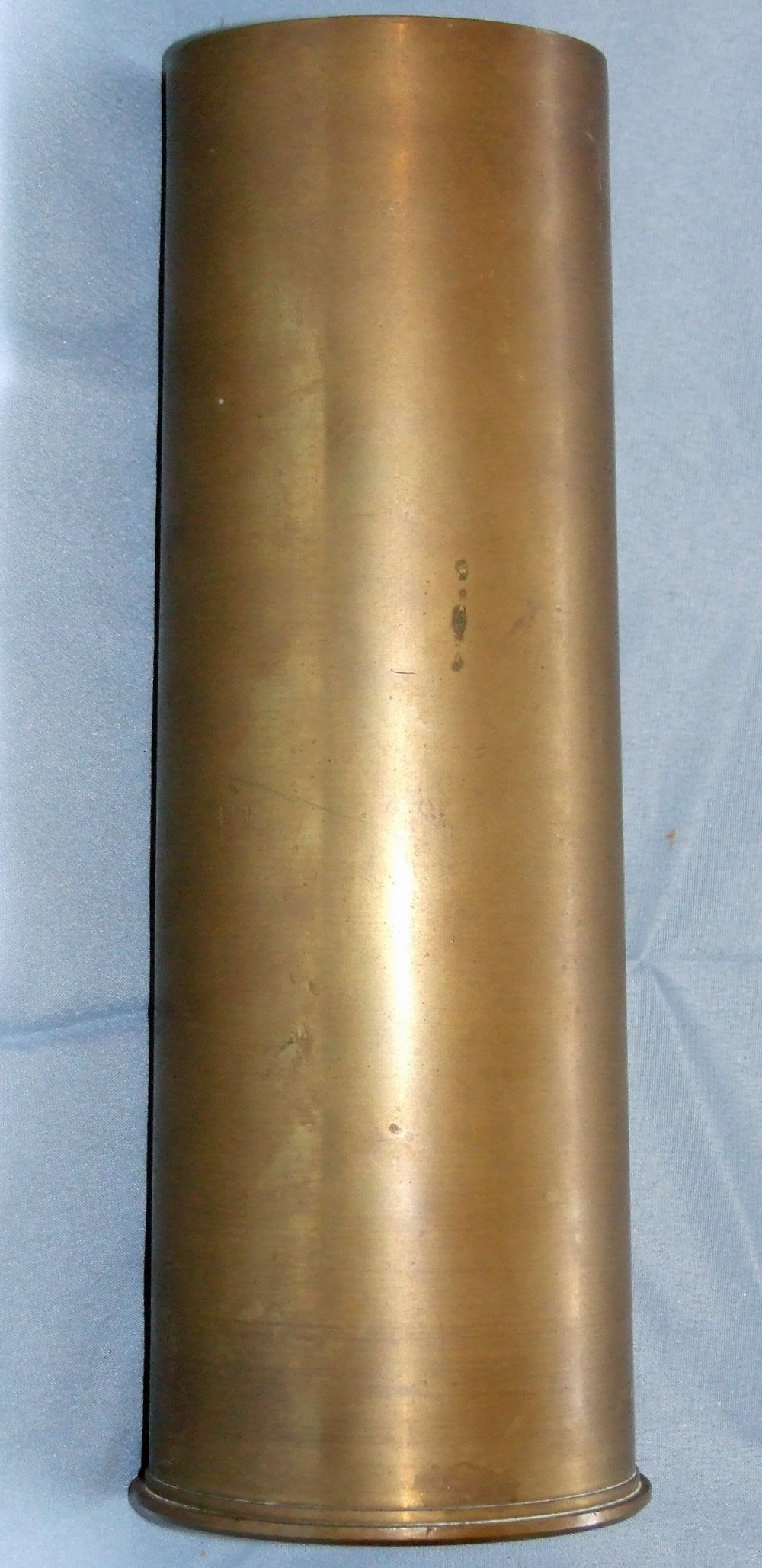 A collection of cartridge cases to include a 3in. cartridge case, with fired primer, base of case