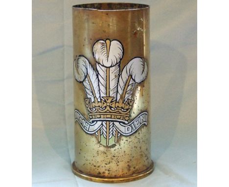 A 105mm British brass cartridge for use in the 105mm Light Gun, with fired primer, transfer of Prince of Wales feathers appli
