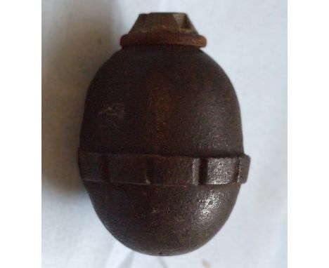 A German Hand Eierhandgranate, WW1, cast iron body painted black with alloy nose plug and leather washed, stamped on undersid