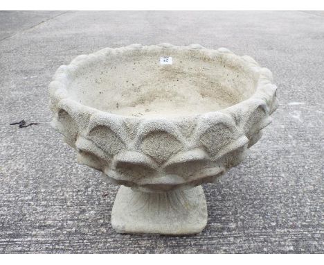 Garden Stoneware - A reconstituted stone pineapple pattern planter on circular base.