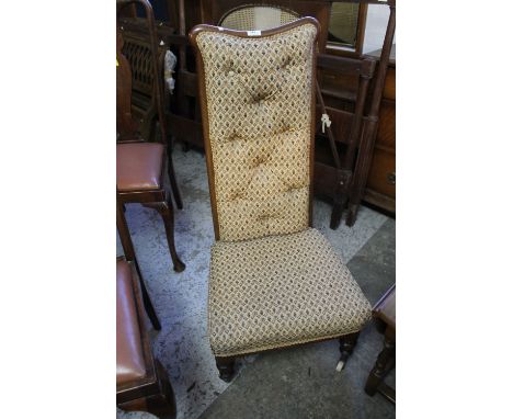 Late 19th/early 20th century mahogany upholstered button back low bedroom chair on ceramic casters. 
