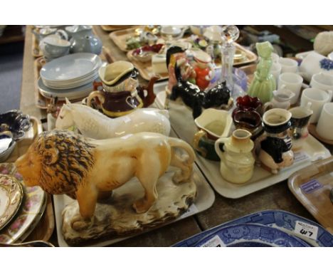 Two trays of assorted china and glassware to include pottery study of striding lion on naturalistic base, white Beswick china