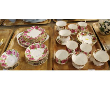 Two trays of Royal Albert bone china 'Old English Rose' design part tea ware items comprising cups, saucers, plates etc. toge