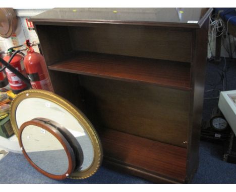Mahogany inlaid three section open bookcase on bracket feet.