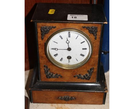 Early 20th century ebonized and walnut veneered single train mantle clock.  