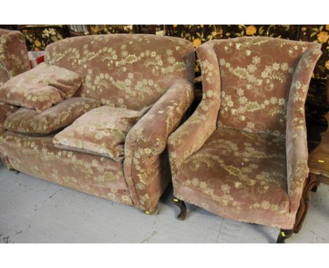 Early 20th century floral and foliate three piece suite comprising two seater sofa, two similar wing type arm chairs. (3)
