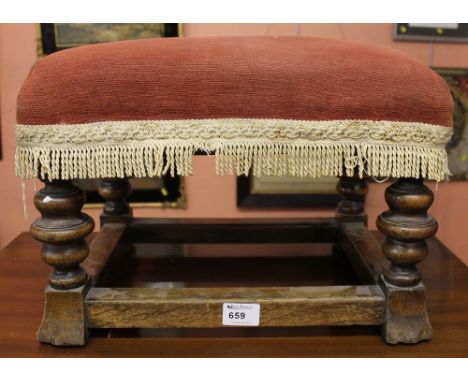 Early 20th century oak upholstered foot stool on ring turned legs and stretchers. 