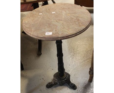 Cast iron tripod circular marble top garden table. 