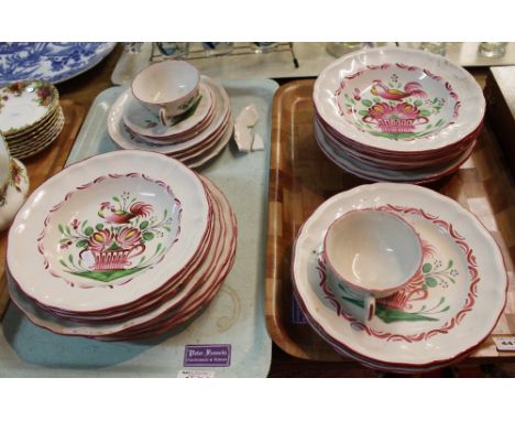 Two trays of St. Clement France tea and dinner ware items overall decorated on white ground with painted cockerels amongst fo