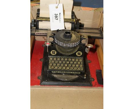 A boxed junior German tinplate child's typewriter. 