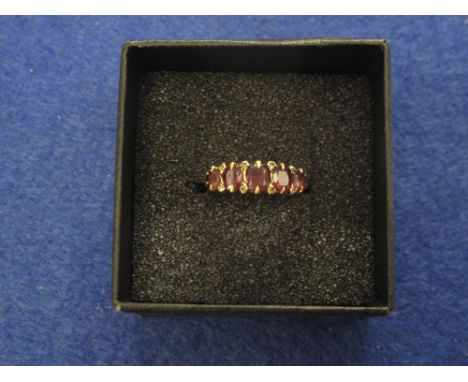 15ct gold garnet five stone ring. 