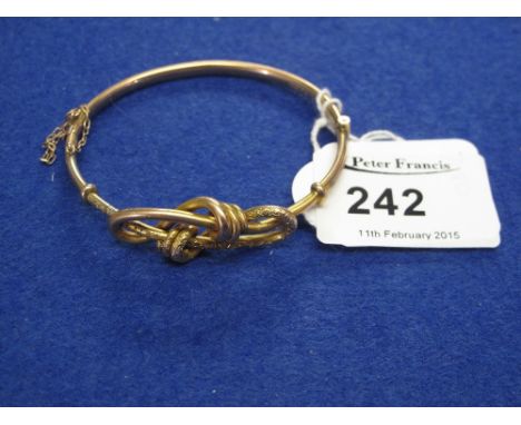 9ct gold ladies knot bangle.  CONDITION REPORT: 8.0grams  Small dinks to bangle, overall ok.